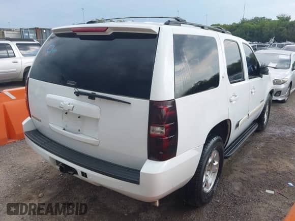 2007 Chevrolet Tahoe LTZ with VIN 1GNFC13017R113004, listed as a IAAI auction lot 43217116 with 161,939 mi miles and . Bid and sale history available at DreamBid. Image 4.