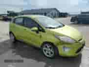 2012 Ford Fiesta SES with VIN 3FADP4FJ6CM117710, listed as a Copart auction lot 64371335 with 92,029 mi miles and Salvage title. Bid and sale history available at DreamBid. Image 4.