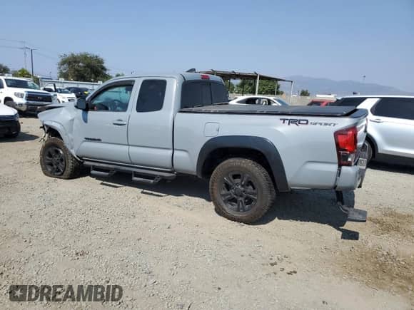 2018 Toyota Tacoma SR5 with VIN 5TFRZ5CNXJX070809, listed as a Copart auction lot 68571935 with 56,970 mi miles and Salvage title. Bid and sale history available at DreamBid. Image 2.