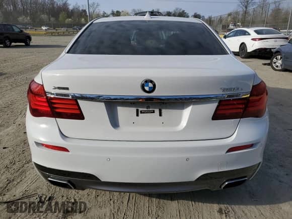 2015 BMW 7 Series 750i xDrive with VIN WBAYB6C50FD225492, listed as a Copart auction lot 50018225 with 76,059 mi miles and Salvage title. Bid and sale history available at DreamBid. Image 6.