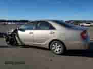 2002 Toyota Camry LE z VIN 4T1BE32K82U588621, wystawiony jako Copart lot #86985085 z przebiegiem 252 745 mil mil oraz Szkoda całkowita • Salvage title. Historia ofert i sprzedaży dostępna na DreamBid. Obrazek 2.