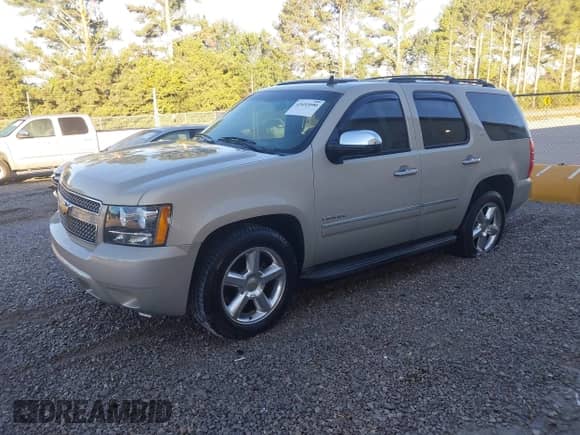 2011 Chevrolet Tahoe LTZ with VIN 1GNSCCE06BR334632, listed as a IAAI auction lot 43493090 with 166,769 mi miles and . Bid and sale history available at DreamBid. Image 2.