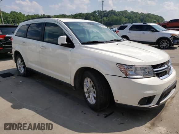 2014 Dodge Journey SXT with VIN 3C4PDCBB6ET134685, listed as a Copart auction lot 58577595 with 213,926 mi miles and Salvage title. Bid and sale history available at DreamBid. Image 4.