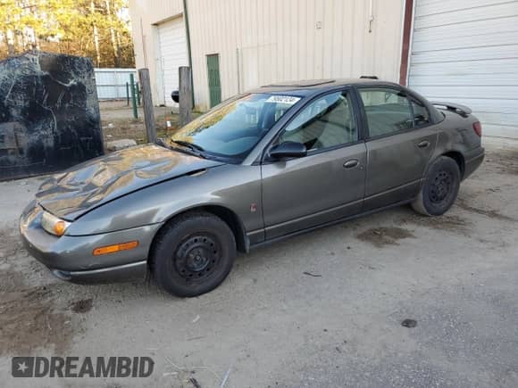 2000 Saturn SL with VIN 1G8ZJ5274YZ256204, listed as a Copart auction lot 79502124 with 190,120 mi miles and Salvage title. Bid and sale history available at DreamBid. Image 1.