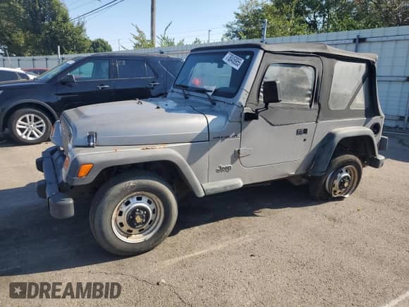 2000 Jeep Wrangler SE with VIN 1J4FA29P4YP775935, listed as a Copart auction lot 80458955 with 100,211 mi miles and Salvage title. Bid and sale history available at DreamBid. Image 1.