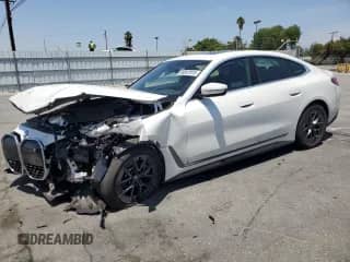 2024 BMW i4 eDrive40 with VIN WBY73AW05RFT13458, listed as a Copart auction lot 58047015 with 10,553 mi miles and Salvage title. Bid and sale history available at DreamBid. Image 1.