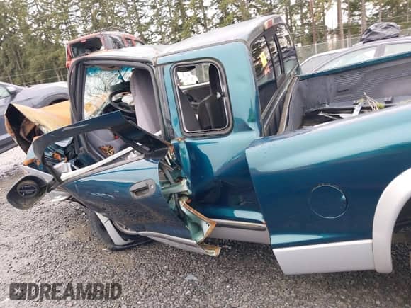 1997 Dodge Dakota z VIN 1B7GG23X9VS242604, wystawiony jako IAAI lot #41772203 z przebiegiem Nie podano mil oraz . Historia ofert i sprzedaży dostępna na DreamBid. Obrazek 13.