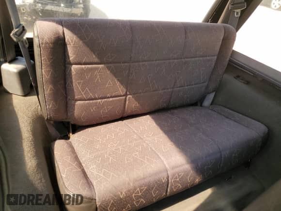 2002 Jeep Wrangler X z VIN 1J4FA39S92P729342, wystawiony jako Copart lot #56130275 z przebiegiem 132 566 mil mil oraz Szkoda całkowita • Salvage title. Historia ofert i sprzedaży dostępna na DreamBid. Obrazek 11.