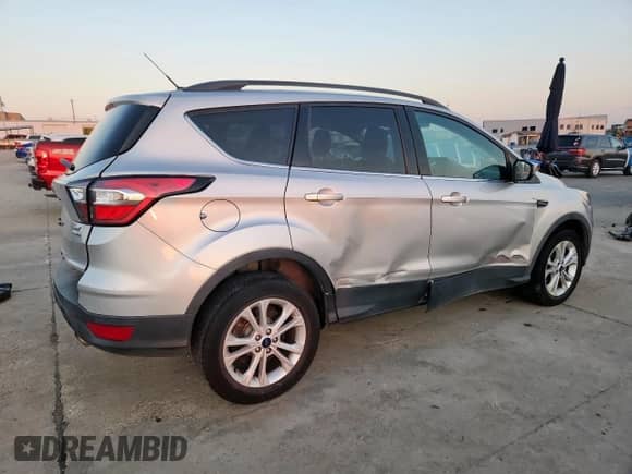 2018 Ford Escape SE with VIN 1FMCU9GD0JUB93710, listed as a Copart auction lot 85751065 with 138,902 mi miles and Salvage title. Bid and sale history available at DreamBid. Image 3.