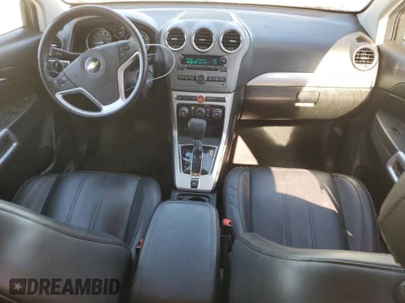 2012 Chevrolet Captiva Sport LTZ z VIN 3GNFL4E56CS594174, wystawiony jako Copart lot #74492554 z przebiegiem 129 625 mil mil oraz Czysty tytuł • Clean title. Historia ofert i sprzedaży dostępna na DreamBid. Obrazek 8.