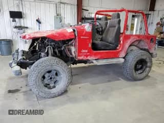 2003 Jeep Wrangler Sport z VIN 1J4FA49S23P311969, wystawiony jako Copart lot #57885525 z przebiegiem 177 489 mil mil oraz Czysty tytuł • Clean title. Historia ofert i sprzedaży dostępna na DreamBid. Obrazek 1.