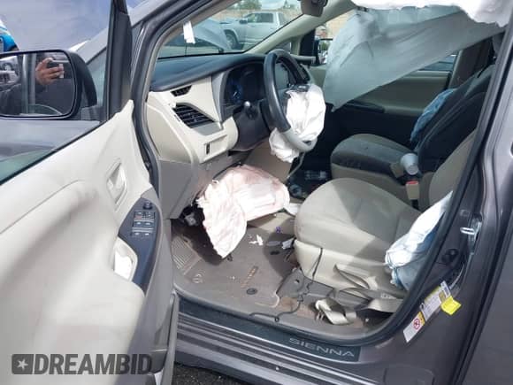 2019 Toyota Sienna L with VIN 5TDZZ3DCXKS966861, listed as a IAAI auction lot 41739828 with 64,305 mi miles and . Bid and sale history available at DreamBid. Image 5.