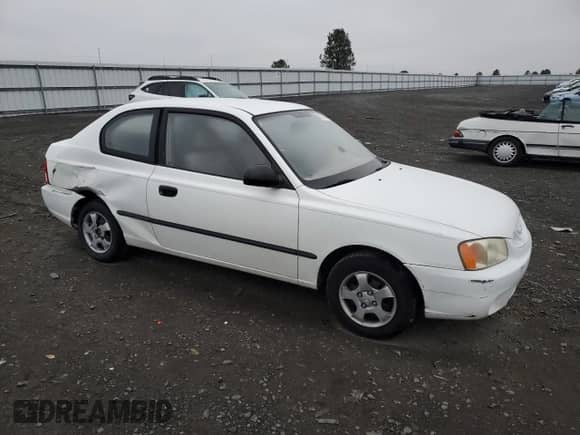 2002 Hyundai Accent z VIN KMHCF35G52U207137, wystawiony jako Copart lot #82818574 z przebiegiem 185 177 mil mil oraz Szkoda całkowita • Salvage title. Historia ofert i sprzedaży dostępna na DreamBid. Obrazek 4.