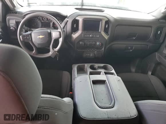 2021 Chevrolet Silverado 1500 Custom с VIN 1GCRWBEH6MZ115879, выставлен на аукционе Copart как лот 74552314 с пробегом Не указан миль и Списание • Salvage title. История ставок и продаж доступна на DreamBid. Изображение 8.