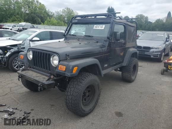 2003 Jeep Wrangler Rubicon с VIN 1J4FA69S93P334595, выставлен на аукционе Copart как лот 68247145 с пробегом 127 361 миль миль и Списание • Salvage title. История ставок и продаж доступна на DreamBid. Изображение 1.