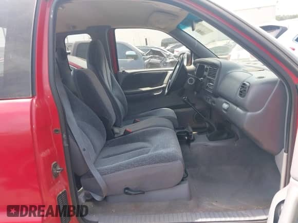 1999 Dodge Dakota SLT z VIN 1B7GL22X2XS129464, wystawiony jako IAAI lot #41975506 z przebiegiem 99 437 mil mil oraz . Historia ofert i sprzedaży dostępna na DreamBid. Obrazek 5.