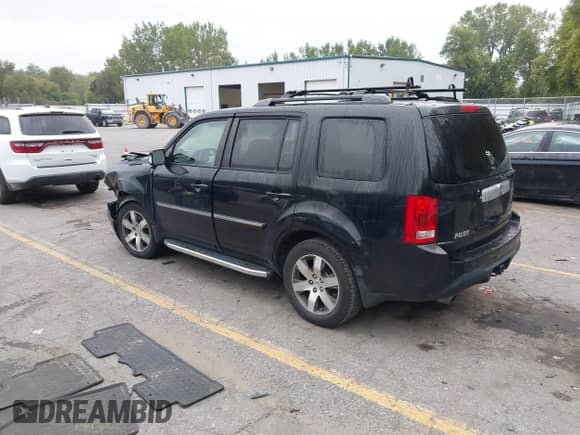 2013 Honda Pilot Touring with VIN 5FNYF4H97DB047819, listed as a IAAI auction lot 43299908 with 253,413 mi miles and . Bid and sale history available at DreamBid. Image 3.