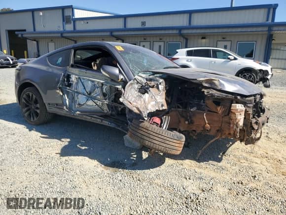 2015 Hyundai Genesis Coupe R-Spec with VIN KMHHU6KJ5FU122785, listed as a Copart auction lot 77006244 with Not provided miles and Salvage title. Bid and sale history available at DreamBid. Image 4.
