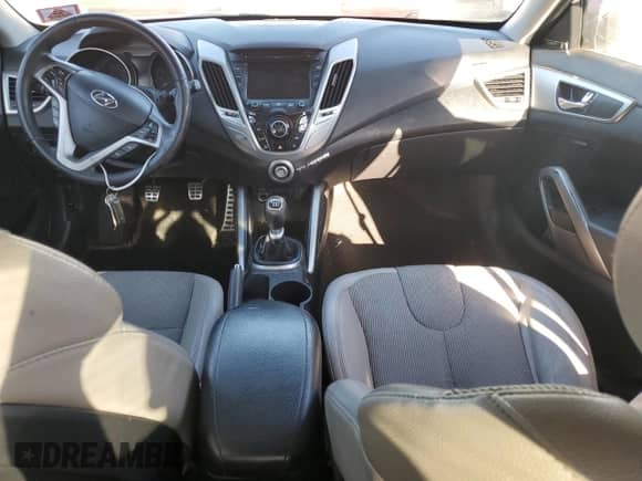 2012 Hyundai Veloster w/Gray Int z VIN KMHTC6AD3CU021197, wystawiony jako Copart lot #84803605 z przebiegiem 170 338 mil mil oraz Szkoda całkowita • Salvage title. Historia ofert i sprzedaży dostępna na DreamBid. Obrazek 9.