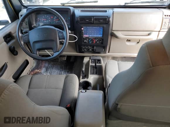 2003 Jeep Wrangler Sahara с VIN 1J4FA59S03P313418, выставлен на аукционе Copart как лот 64883094 с пробегом 184 658 миль миль и Списание • Salvage title. История ставок и продаж доступна на DreamBid. Изображение 8.