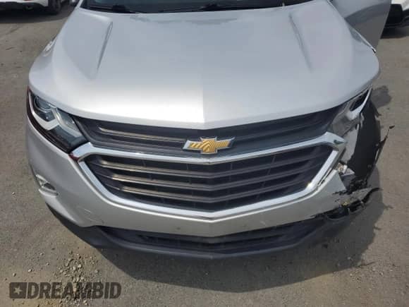 2020 Chevrolet Equinox LT z VIN 3GNAXUEV2LS528221, wystawiony jako Copart lot #65551805 z przebiegiem Nie podano mil oraz Szkoda całkowita • Salvage title. Historia ofert i sprzedaży dostępna na DreamBid. Obrazek 12.