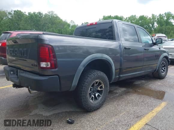2015 Ram 1500 Rebel with VIN 1C6RR7YTXFS785507, listed as a IAAI auction lot 42172925 with 100,201 mi miles and . Bid and sale history available at DreamBid. Image 4.