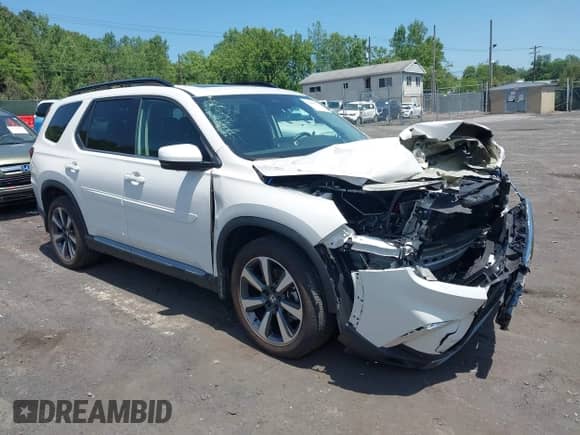 2023 Honda Pilot Elite with VIN 5FNYG1H85PB025485, listed as a IAAI auction lot 42445563 with 10,445 mi miles and . Bid and sale history available at DreamBid. Image 1.