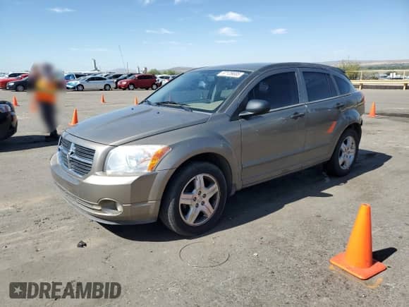 2007 Dodge Caliber SXT with VIN 1B3HB48B57D203433, listed as a Copart auction lot 67139005 with 123,601 mi miles and Salvage title. Bid and sale history available at DreamBid. Image 1.