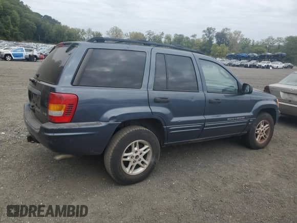 2004 Jeep Grand Cherokee Laredo with VIN 1J4GW48N74C319785, listed as a Copart auction lot 81492775 with 279,289 mi miles and Clean title. Bid and sale history available at DreamBid. Image 3.