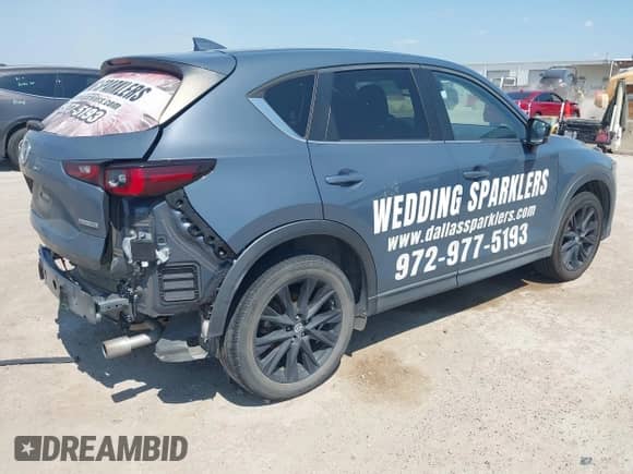 2022 Mazda CX-5 S Preferred with VIN JM3KFBCM9N0529494, listed as a IAAI auction lot 43179890 with 57,495 mi miles and . Bid and sale history available at DreamBid. Image 4.