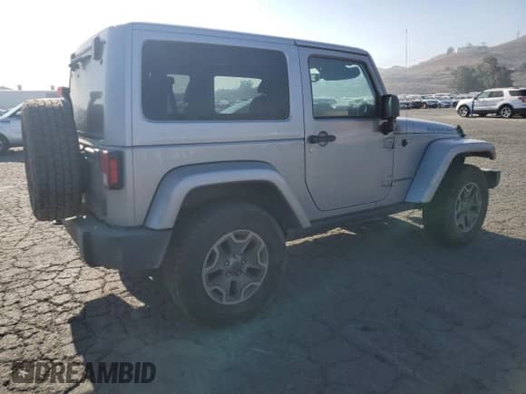 2014 Jeep Wrangler Rubicon with VIN 1C4BJWCG7EL206665, listed as a Copart auction lot 86903384 with 413,442 mi miles and Salvage title. Bid and sale history available at DreamBid. Image 3.