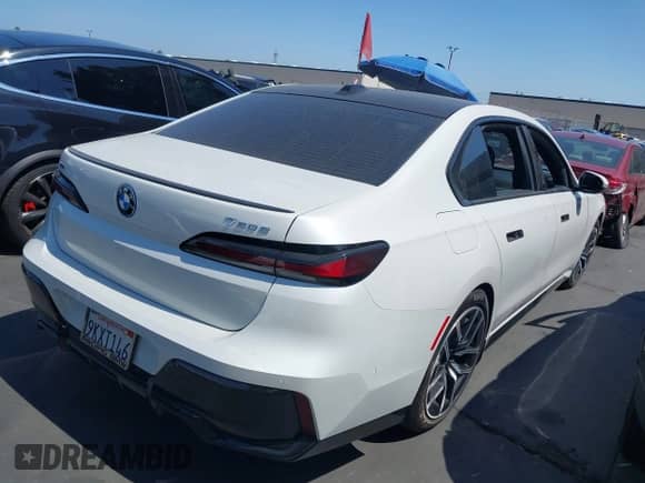 2024 BMW 7 Series with VIN WBA43EH07RCP32323, listed as a IAAI auction lot 42499320 with 12,504 mi miles and . Bid and sale history available at DreamBid. Image 4.