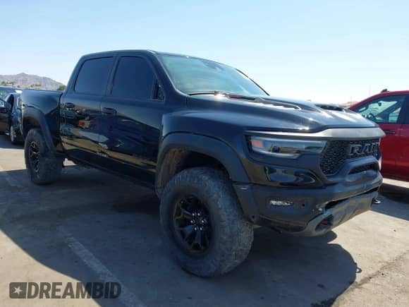 2022 Ram 1500 TRX with VIN 1C6SRFU99NN215579, listed as a IAAI auction lot 42475901 with 37,736 mi miles and . Bid and sale history available at DreamBid. Image 1.