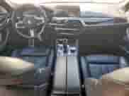 2018 BMW 5 Series M550i xDrive with VIN WBAJB9C54JB034746, listed as a Copart auction lot 71218435 with 128,279 mi miles and Clean title. Bid and sale history available at DreamBid. Image 8.