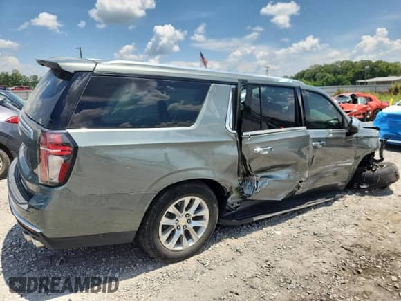 2023 Chevrolet Suburban Premier z VIN 1GNSCFKD5PR377441, wystawiony jako Copart lot #65782875 z przebiegiem 56 474 mil mil oraz Szkoda całkowita • Salvage title. Historia ofert i sprzedaży dostępna na DreamBid. Obrazek 3.