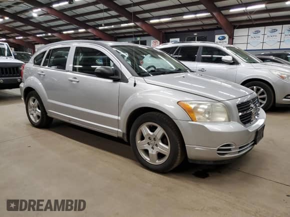 2009 Dodge Caliber SXT with VIN 1B3HB48A89D136949, listed as a Copart auction lot 90877325 with 174,077 mi miles and Clean title. Bid and sale history available at DreamBid. Image 4.