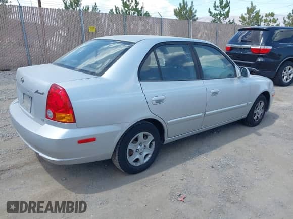 2003 Hyundai Accent GL z VIN KMHCG45C13U430017, wystawiony jako IAAI lot #42625444 z przebiegiem 151 458 mil mil oraz . Historia ofert i sprzedaży dostępna na DreamBid. Obrazek 4.