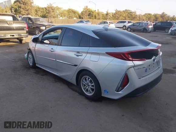 2021 Toyota Prius LE with VIN JTDKAMFP9M3166300, listed as a IAAI auction lot 43400137 with 64,301 mi miles and . Bid and sale history available at DreamBid. Image 3.