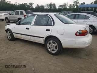2000 Chevrolet Prizm z VIN 1Y1SK5281YZ415530, wystawiony jako Copart lot #60704824 z przebiegiem Nie podano mil oraz Szkoda całkowita • Salvage title. Historia ofert i sprzedaży dostępna na DreamBid. Obrazek 2.