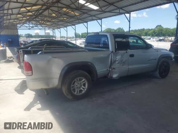 2002 Dodge Dakota с VIN 1B7GL12X32S566683, выставлен на аукционе Copart как лот 56896145 с пробегом 229 321 миль миль и Списание • Salvage title. История ставок и продаж доступна на DreamBid. Изображение 3.