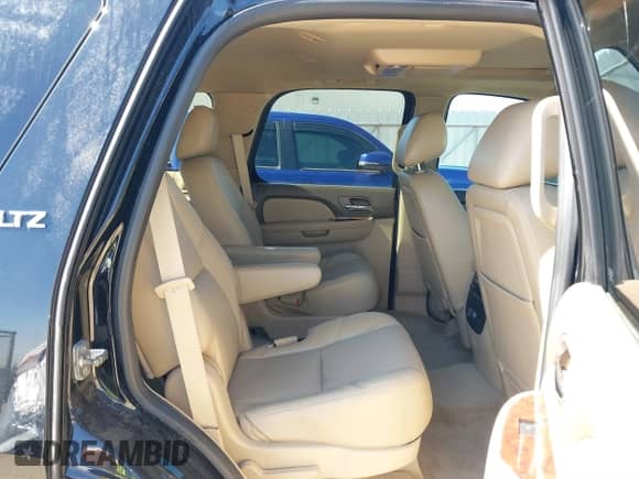 2014 Chevrolet Tahoe LTZ with VIN 1GNSCCE04ER141920, listed as a IAAI auction lot 41484239 with 98,855 mi miles and . Bid and sale history available at DreamBid. Image 8.