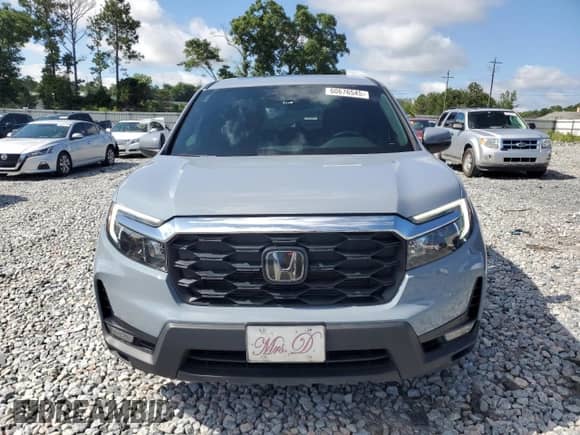 2024 Honda Passport EX-L with VIN 5FNYF8H5XRB018374, listed as a Copart auction lot 60676545 with 30,898 mi miles and Salvage title. Bid and sale history available at DreamBid. Image 5.