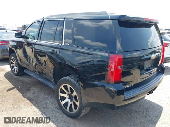 2018 Chevrolet Tahoe LT z VIN 1GNSKBKC3JR101172, wystawiony jako IAAI lot #42760851 z przebiegiem 124 409 mil mil oraz . Historia ofert i sprzedaży dostępna na DreamBid. Obrazek 3.