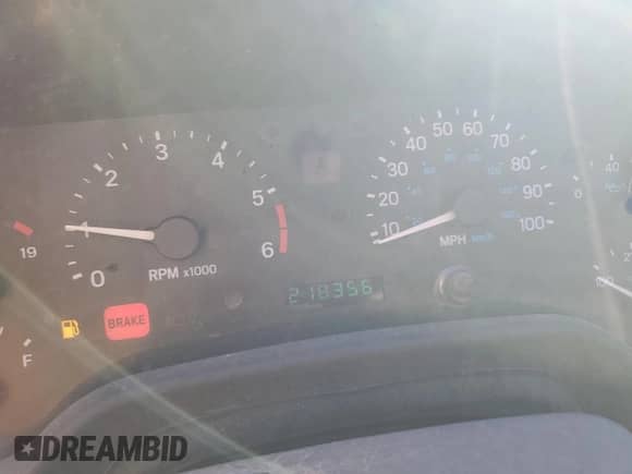 1999 Jeep Wrangler Sport with VIN 1J4FY19S1XP455674, listed as a Copart auction lot 86821605 with 218,356 mi miles and Clean title. Bid and sale history available at DreamBid. Image 9.