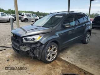 2017 Ford Escape Titanium with VIN 1FMCU0J91HUD04386, listed as a Copart auction lot 55525535 with 127,440 mi miles and Salvage title. Bid and sale history available at DreamBid. Image 1.