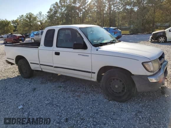 1999 Toyota Tacoma z VIN 4TAVL52N5XZ561492, wystawiony jako Copart lot #86814935 z przebiegiem 279 608 mil mil oraz Szkoda całkowita • Salvage title. Historia ofert i sprzedaży dostępna na DreamBid. Obrazek 4.