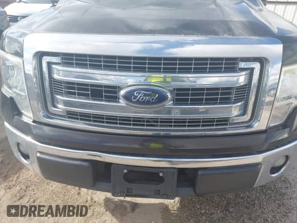 2013 Ford F-150 XL z VIN 1FTFW1CF3DKF93913, wystawiony jako IAAI lot #43389853 z przebiegiem 119 937 mil mil oraz . Historia ofert i sprzedaży dostępna na DreamBid. Obrazek 6.