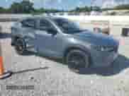 2023 Mazda CX-5 S Carbon Edition z VIN JM3KFBCM7P0169757, wystawiony jako Copart lot #70624645 z przebiegiem 31 275 mil mil oraz Szkoda całkowita • Salvage title. Historia ofert i sprzedaży dostępna na DreamBid. Obrazek 4.