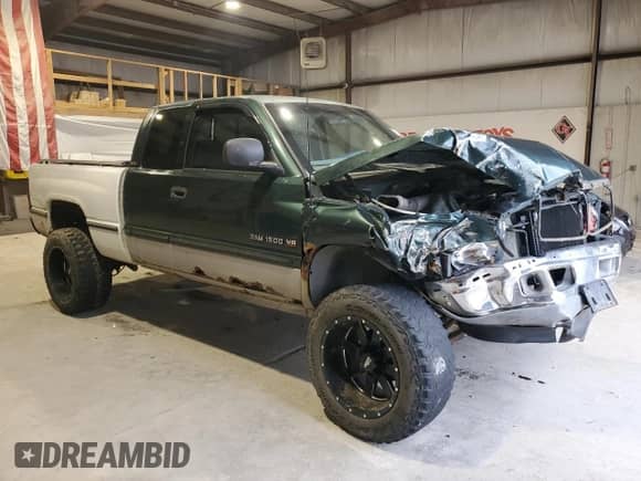 1998 Dodge 1500 with VIN 3B7HF13Y3WG183620, listed as a Copart auction lot 86992874 with 173,441 mi miles and Salvage title. Bid and sale history available at DreamBid. Image 4.