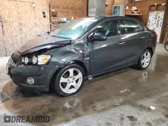 2014 Chevrolet Sonic LTZ с VIN 1G1JE5SB1E4177277, выставлен на аукционе Copart как лот 52375035 с пробегом Не указан миль и Списание • Salvage title. История ставок и продаж доступна на DreamBid. Изображение 1.